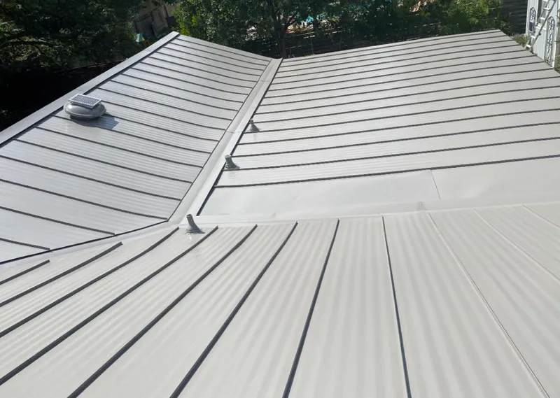Solar attic fan installed on a metal roof for Roof Ventilation in Rossmoor